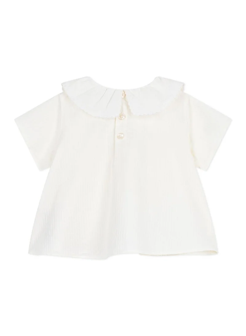 بيتي باتو Babies' short-sleeved blouse in plain cotton poplin.